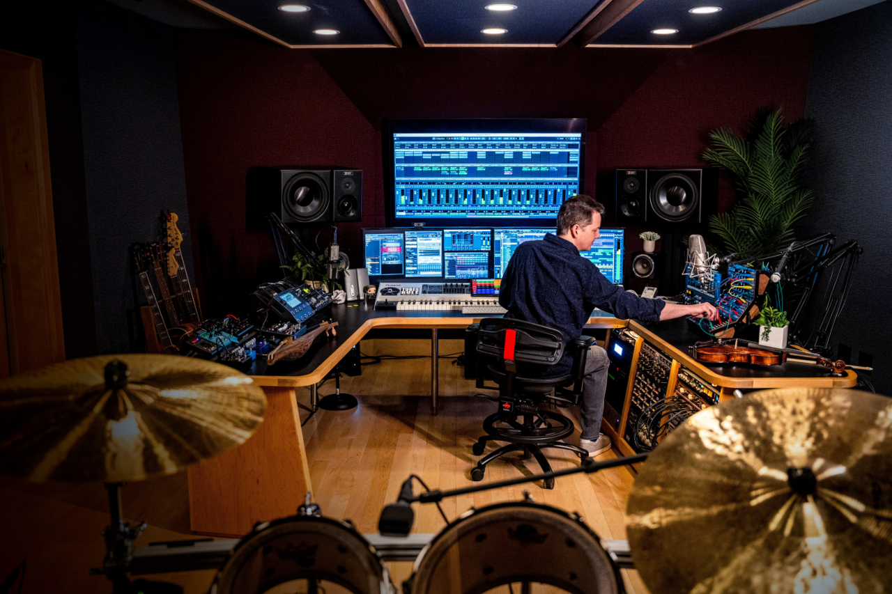 Jason Graves working at his studio scoring console